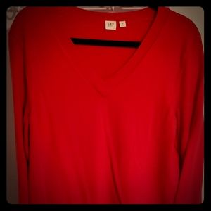 Red long sleeved V neck sweater